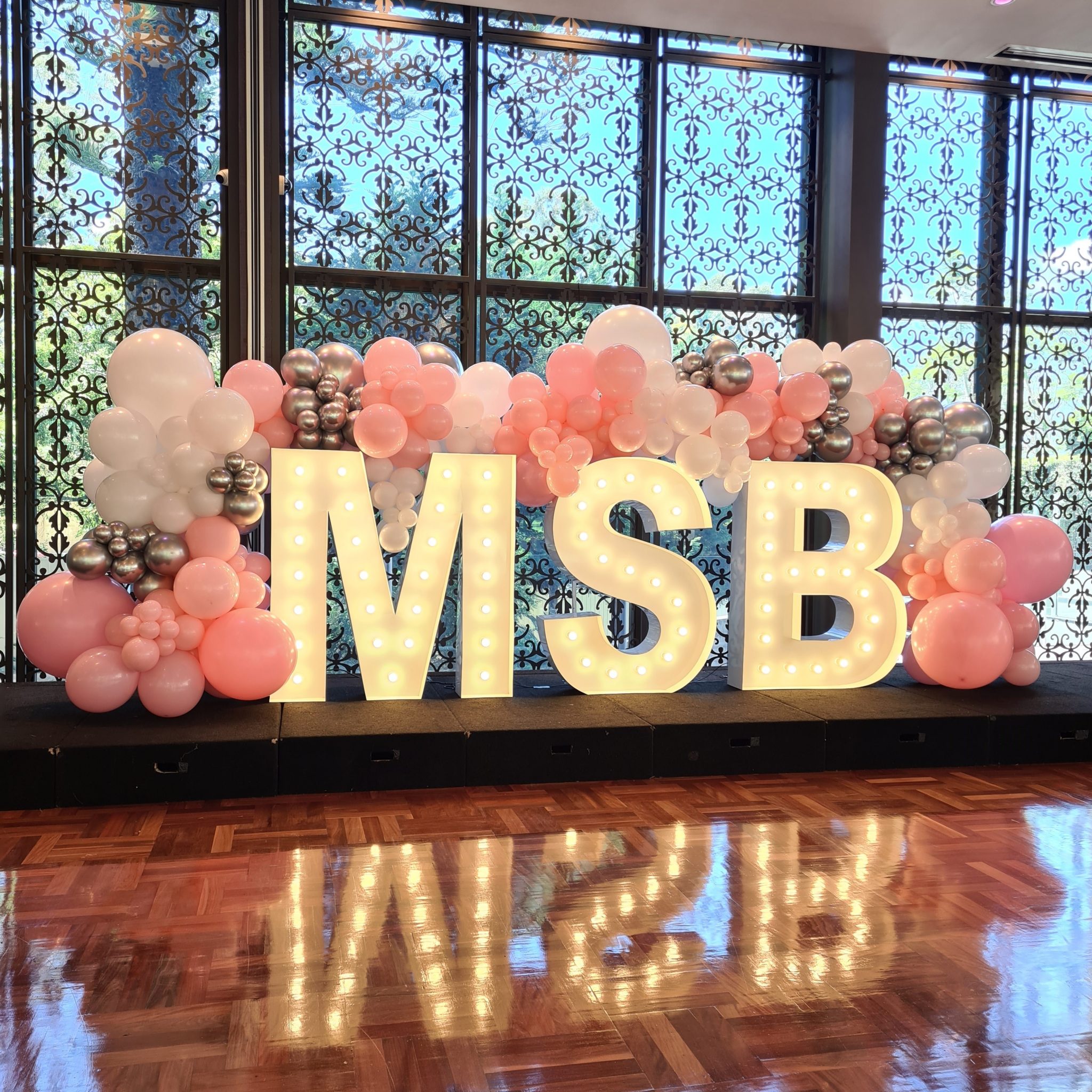 Organic Balloon Garland Over Marquee Lights Party Splendour