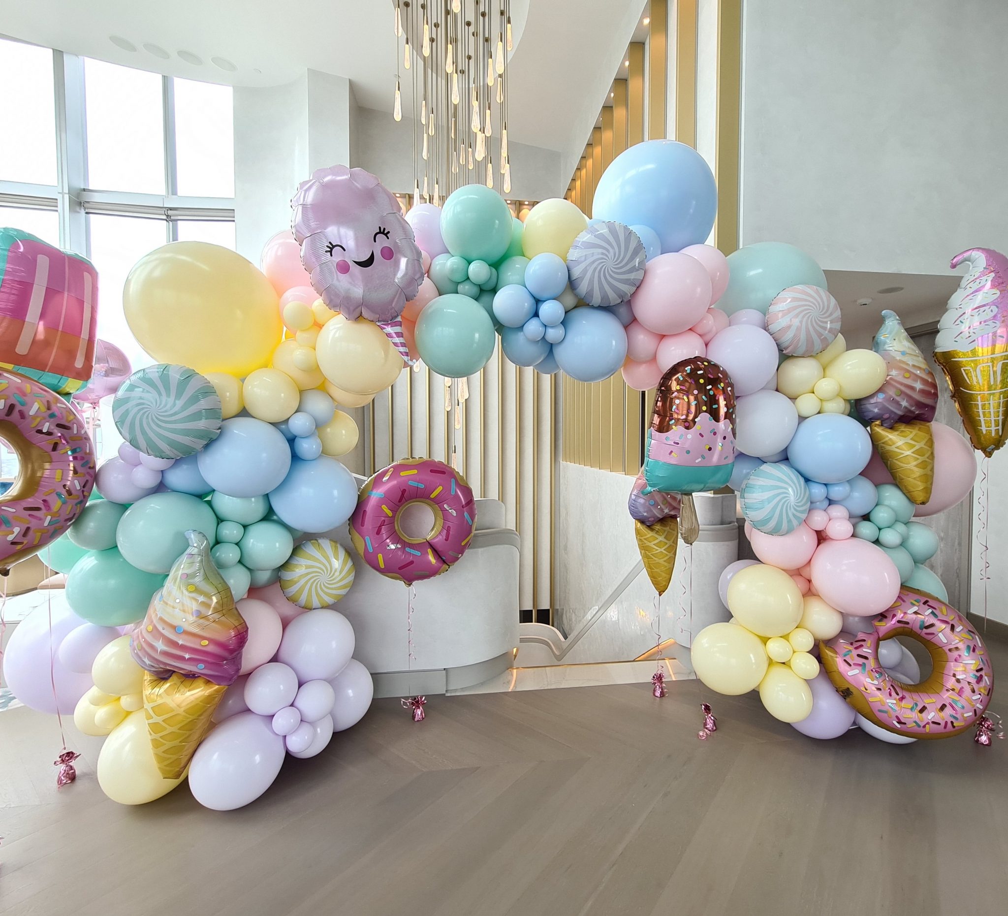 Choosing Between Balloon Bouquets and Arches for Your Next Party  - Organic Full Arch in Custom Pastels Jumbos Foils 2048x1861 1